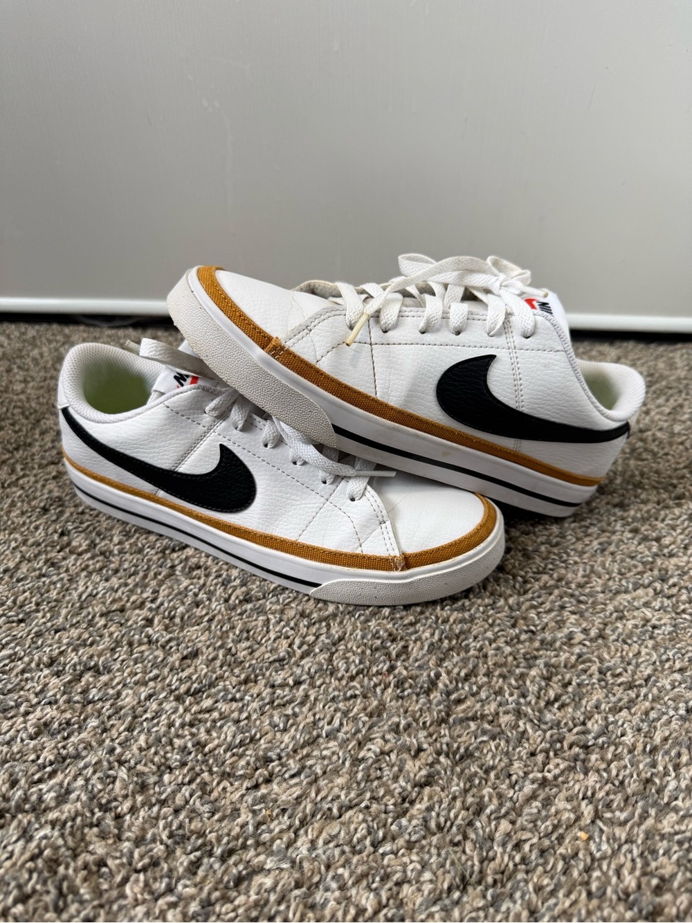 Nike White Sneakers with Black Swoosh and Brown Trim